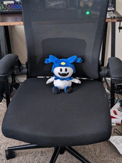 Picture of a jack frost plushy sitting on a new office chair